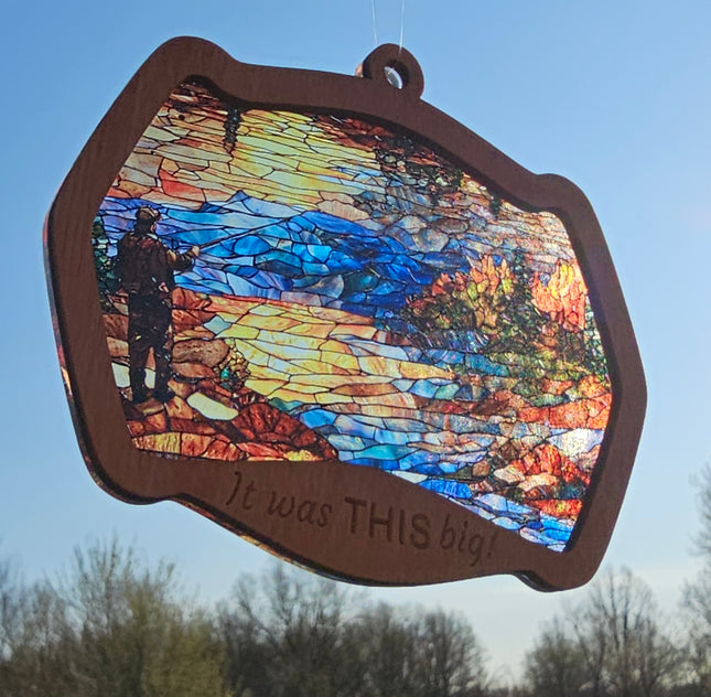image of a fisherman fishing in a lake. The transparent acrylic background has a stained glass effect. The laser engraving at the bottom of the wooden top piece says "It was THIS big!"