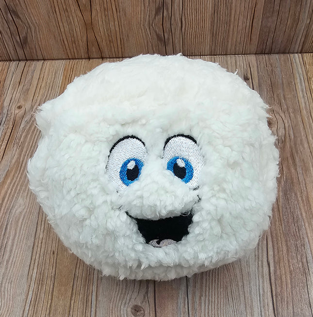 A white fluffy plush dog toy with a smiling face. The toy has blue eyes and a black mouth. The toy is shaped like a ball