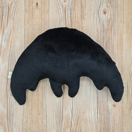 Back view of black plush mothman toy.