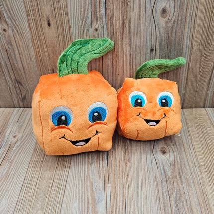 image of both sizes of plush pumpkin dog toys together
