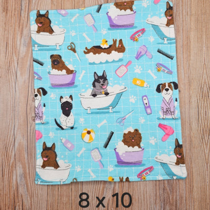 image of 8x10 flannel towel with dogs in the bath and grooming supplies  on a light blue background