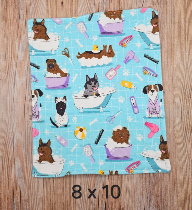 image of 8x10 flannel towel with dogs in the bath and grooming supplies  on a light blue background