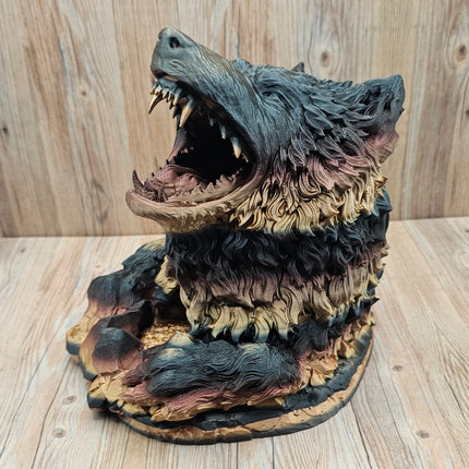 image of 3d printed dire wolf dice tower showing the red, black, and gold gradient when printed. The wolf has more black and gold tones in this particular print. 
