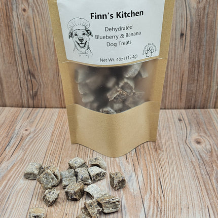 Bag of Finn's Kitchen dehydrated blueberry and banana dog treats on a wooden surface