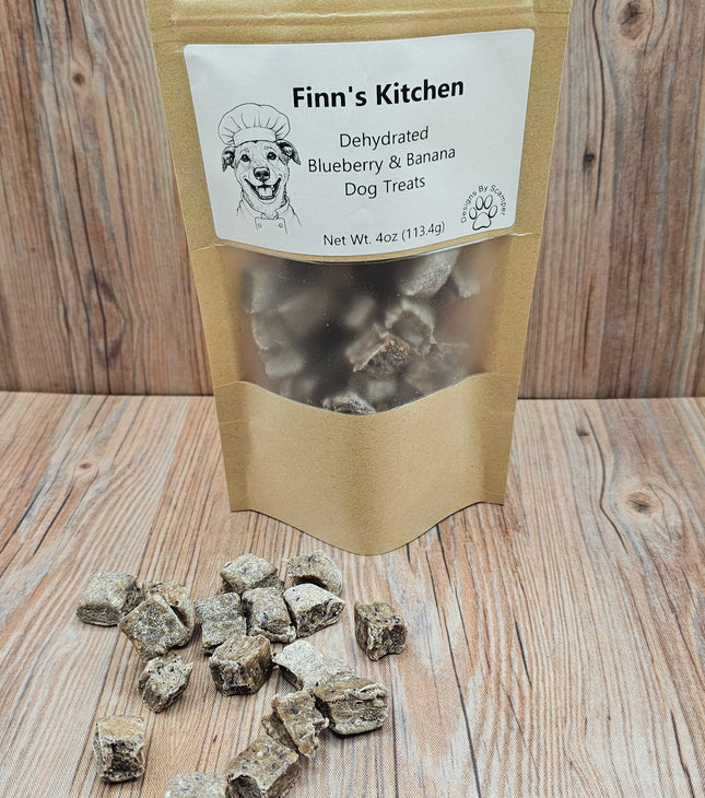 Bag of Finn's Kitchen dehydrated blueberry and banana dog treats on a wooden surface