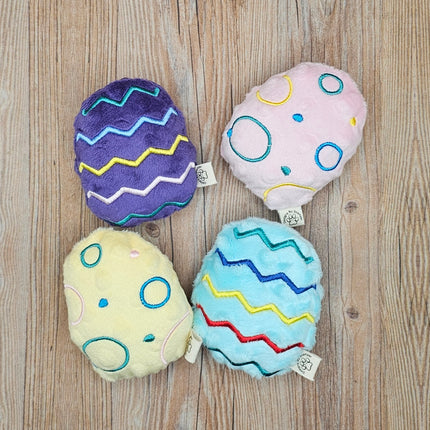 main picture of all 4 embroidered easter egg plush cat toys. 