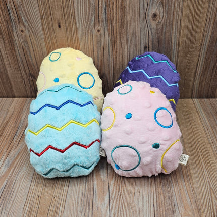 main picture of 4 plush easter egg dog toys with embroidered designs