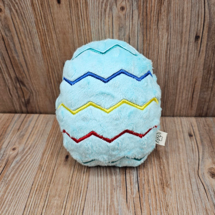 plush light blue easter egg dog toy with embroidered zigzag pattern