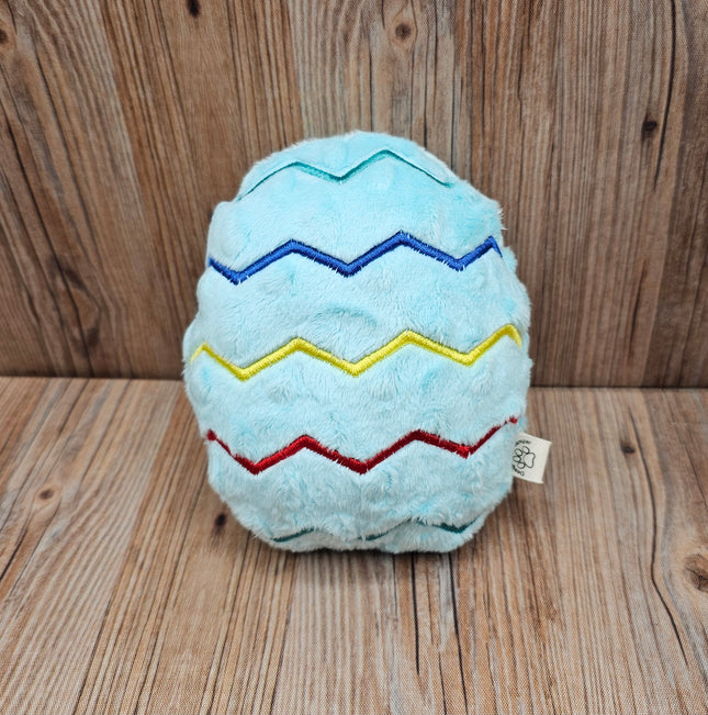 plush light blue easter egg dog toy with embroidered zigzag pattern