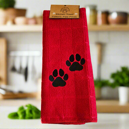 100% polyester, red kitchen towel with 2 embroidered black paw prints