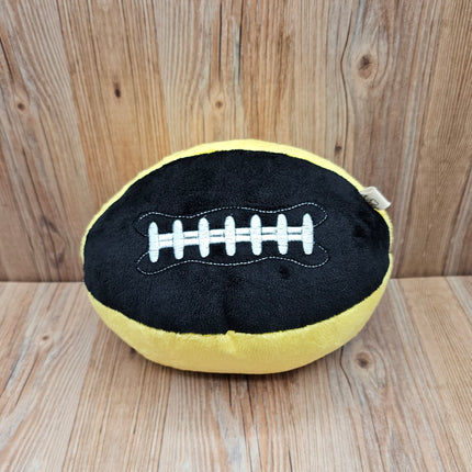 image of plush football dog toy in black/yellow with embroidered laces