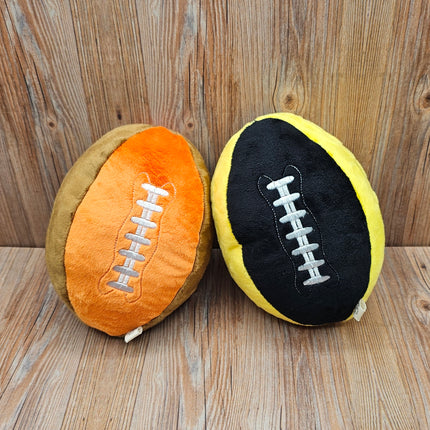 image of 2 plush football dog toys in orange/brown and black/yellow with embroidered laces