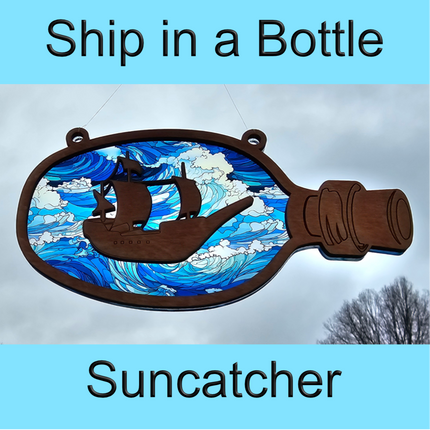 an image of a wooden suncatcher in the shape of a bottle with a pirate ship laser cut from the center. The transparent acrylic background shows a wavy ocean that the ship is on